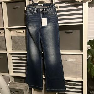 Brand new tags attached kancan bell bottom jeans size 7/27. Lots of stretch